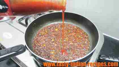 adding-red-chilli-sauce adding-red-chilli-sauce
