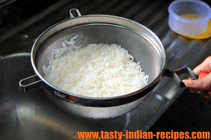Drain boiled rice and keep aside