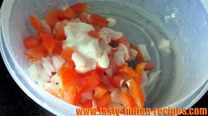 Add chopped vegetables in whisked curd