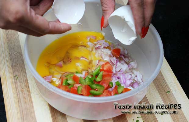 Beat Eggs in the mixture of onion, tomatoes, capsicum and green chilies
