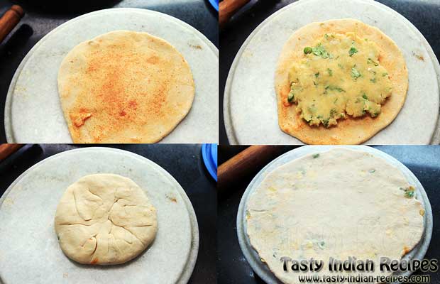 Make a small roti from dough, spread little oil, sprinkle some red chili powder and place aloo mixture in center. Seal the edges and roll into a round disc