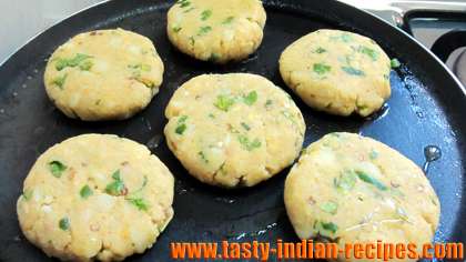 Aloo patties on hot griddle