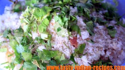 Mixing ingredients in mashed aloo potatoes for making patties