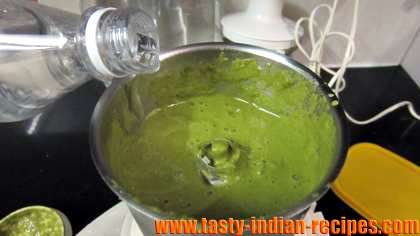 adding water into a chutney