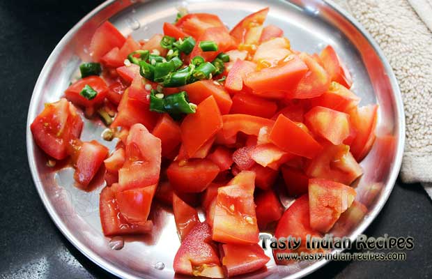 Chop tomatoes and green chilies