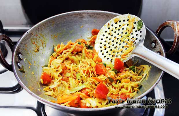 Add red chili powder, turmeric powder, sugar, coriander powder, dry mango powder and salt to taste. Stir fry on medium flame till the mixture dries