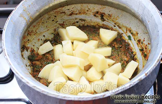 Mixing Potatoes in Methi