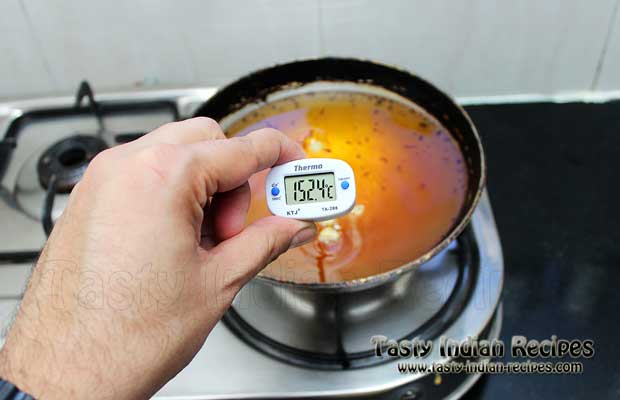 Checking Oil Temperature With Thermometer