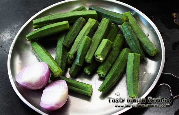 Slit Bhindi vertically and chop the onion in big chunks